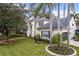 Beautiful two-story home with well-manicured lawn, mature landscaping and attached two car garage at 231 Chestnut Ridge St, Winter Springs, FL 32708