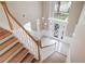 Two-story foyer with marble floors and decorative entry door at 231 Chestnut Ridge St, Winter Springs, FL 32708