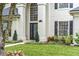 Elegant home facade featuring a grand entrance with a decorative glass door and manicured landscaping at 231 Chestnut Ridge St, Winter Springs, FL 32708