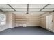 Clean and spacious garage with shelving and ample storage space at 231 Chestnut Ridge St, Winter Springs, FL 32708
