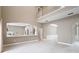 Open-concept living space with high ceilings, archways, and sleek marble flooring, creating an inviting atmosphere at 231 Chestnut Ridge St, Winter Springs, FL 32708