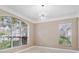 Bright living room featuring large windows that offer natural light at 231 Chestnut Ridge St, Winter Springs, FL 32708
