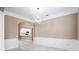 Open-concept living area with view to kitchen, marble floors, and a modern chandelier at 231 Chestnut Ridge St, Winter Springs, FL 32708