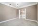 Spacious living room featuring white marble floors and a modern chandelier at 231 Chestnut Ridge St, Winter Springs, FL 32708