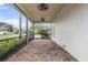 Screened patio with brick pavers, ceiling fans, and outdoor living space at 231 Chestnut Ridge St, Winter Springs, FL 32708