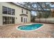 Inviting screened pool area with brick pavers and access to backyard at 231 Chestnut Ridge St, Winter Springs, FL 32708