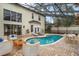 Inviting screened pool area with brick pavers and comfortable outdoor seating at 231 Chestnut Ridge St, Winter Springs, FL 32708
