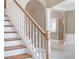 Elegant staircase with white risers and wood treads leading to the upper level at 231 Chestnut Ridge St, Winter Springs, FL 32708