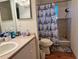 Bathroom featuring a shower and tub combo, new mirror, and a nautical patterned shower curtain at 2328 Midtown Ter # 1024, Orlando, FL 32839