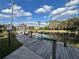 Scenic boardwalk with a gazebo overlooking a tranquil lake, promoting outdoor enjoyment at 2328 Midtown Ter # 1024, Orlando, FL 32839
