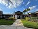 Beautiful clubhouse entrance featuring well-manicured landscaping and an inviting walkway at 2328 Midtown Ter # 1024, Orlando, FL 32839