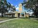 Inviting commercial building with clock tower, manicured lawn, and easy sidewalk access at 2328 Midtown Ter # 1024, Orlando, FL 32839