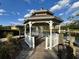 Charming gazebo overlooking the serene community pond with fountain at 2328 Midtown Ter # 1024, Orlando, FL 32839