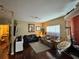 Spacious living room with hardwood floors, comfortable seating, a large window, and neutral paint at 2328 Midtown Ter # 1024, Orlando, FL 32839