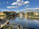Community pond with beautiful fountain and surrounding landscaping and buildings at 2328 Midtown Ter # 1024, Orlando, FL 32839