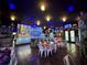 Interior of an exciting restaurant with a long bar, multiple tables and unique decor at 2328 Midtown Ter # 1024, Orlando, FL 32839