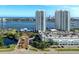 Breathtaking aerial view of towers by the water with palm trees, parking, and city views at 241 Riverside Dr # 201, Daytona Beach, FL 32117