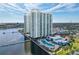 Beautiful aerial of high-rise towers with a pool, bridge to the waterfront and city skyline at 241 Riverside Dr # 201, Daytona Beach, FL 32117