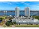 Attractive aerial showing towers, parking, waterway, and city skyline in the background at 241 Riverside Dr # 201, Daytona Beach, FL 32117