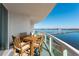 Balcony with outdoor dining set and a panoramic water view, ideal for relaxation and entertainment at 241 Riverside Dr # 201, Daytona Beach, FL 32117