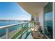 Comfortable balcony seating area with expansive views of the waterfront, bridge and city skyline at 241 Riverside Dr # 201, Daytona Beach, FL 32117