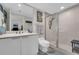 Bathroom features a glass shower, sleek vanity, and modern fixtures at 241 Riverside Dr # 201, Daytona Beach, FL 32117