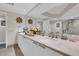 Bathroom featuring a modern vanity with double sinks, a large mirror, and a walk-in glass shower at 241 Riverside Dr # 201, Daytona Beach, FL 32117