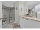 Bright bathroom featuring a glass shower and a vanity with light countertops at 241 Riverside Dr # 201, Daytona Beach, FL 32117