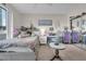 Inviting bedroom featuring a cozy bed, city views, and functional study space at 241 Riverside Dr # 201, Daytona Beach, FL 32117