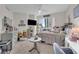 Bright bedroom with a city view, a cozy bed, and a functional study space at 241 Riverside Dr # 201, Daytona Beach, FL 32117