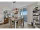 Coastal dining room features water view, pendant lighting, and seating for six at 241 Riverside Dr # 201, Daytona Beach, FL 32117