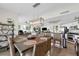 Dining room with table, six chairs, view, open concept kitchen and living area at 241 Riverside Dr # 201, Daytona Beach, FL 32117