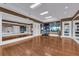 Bright fitness room with hardwood floors, mirrored walls, and exercise equipment at 241 Riverside Dr # 201, Daytona Beach, FL 32117