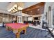 Fun game room with a pool table, seating areas, and a modern entertainment setup at 241 Riverside Dr # 201, Daytona Beach, FL 32117