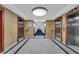 Well-lit hallway with elevators and marble flooring creates an inviting entrance at 241 Riverside Dr # 201, Daytona Beach, FL 32117