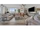 Spacious living room with comfortable seating, ceiling fans, and modern decor at 241 Riverside Dr # 201, Daytona Beach, FL 32117