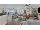 Large living room with an ocean view, two sofas, and a decorative wooden table with books at 241 Riverside Dr # 201, Daytona Beach, FL 32117