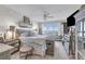 Serene main bedroom with waterfront views, soft color palettes, a ceiling fan, and elegant furnishings at 241 Riverside Dr # 201, Daytona Beach, FL 32117