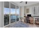 Bright office space with water view, desk, chair, and decorative rug at 241 Riverside Dr # 201, Daytona Beach, FL 32117