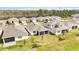 Aerial view of the neighborhood, with a number of single Gathering homes on large lots at 2496 Pine Preserve Ct, St Cloud, FL 34771