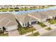 Aerial view of the single-Gathering home situated within a community near a body of water at 2496 Pine Preserve Ct, St Cloud, FL 34771