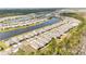Aerial view of new homes, lake and surrounding area at 2496 Pine Preserve Ct, St Cloud, FL 34771