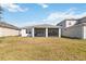 Nice backyard with a screened-in lanai provides an ideal space for outdoor living and entertaining at 2496 Pine Preserve Ct, St Cloud, FL 34771