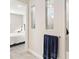 Bright bathroom featuring tiled walls, and dual recessed shelving next to the walk-in shower at 2496 Pine Preserve Ct, St Cloud, FL 34771