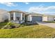 Charming single-story home with a two-car garage, well-maintained lawn, and beautiful brick driveway at 2496 Pine Preserve Ct, St Cloud, FL 34771