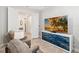 Comfortable living room with large TV and cozy recliners, perfect for relaxation at 2496 Pine Preserve Ct, St Cloud, FL 34771