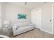 Bright living room features neutral sofa, stylish art, and wood-look floors at 2496 Pine Preserve Ct, St Cloud, FL 34771