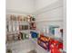 Walk-in pantry with wire shelving, filled with food items and containers at 2496 Pine Preserve Ct, St Cloud, FL 34771