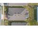 Property aerial view highlighting roof, patio, hot tub, and the surrounding yard at 253 Golden Sands Cir, Davenport, FL 33837