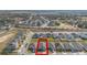 Aerial view of a neighborhood featuring well-maintained lawns, sidewalks, and neatly arranged single-Gathering homes at 253 Golden Sands Cir, Davenport, FL 33837